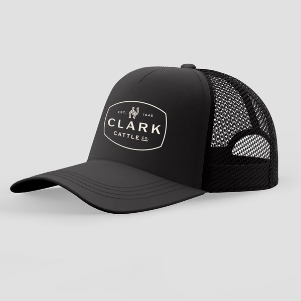 Black trucker hat with white clark cattle co logo