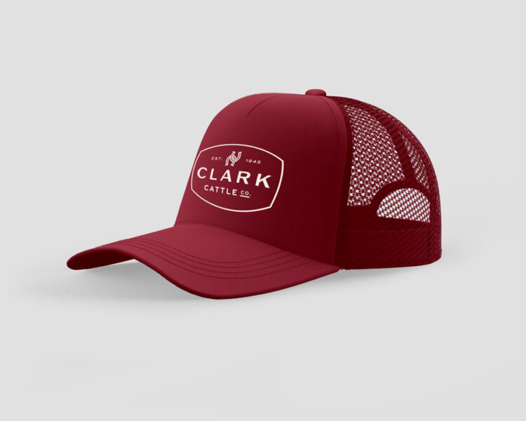 Crimson red trucker hat with Clark Cattle Co. logo