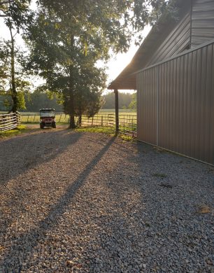 Clark Cattle Building and driveway at sunset